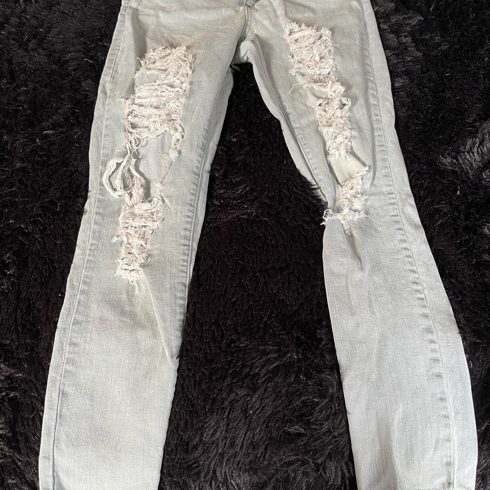 Distressed Miami light wash jeans .